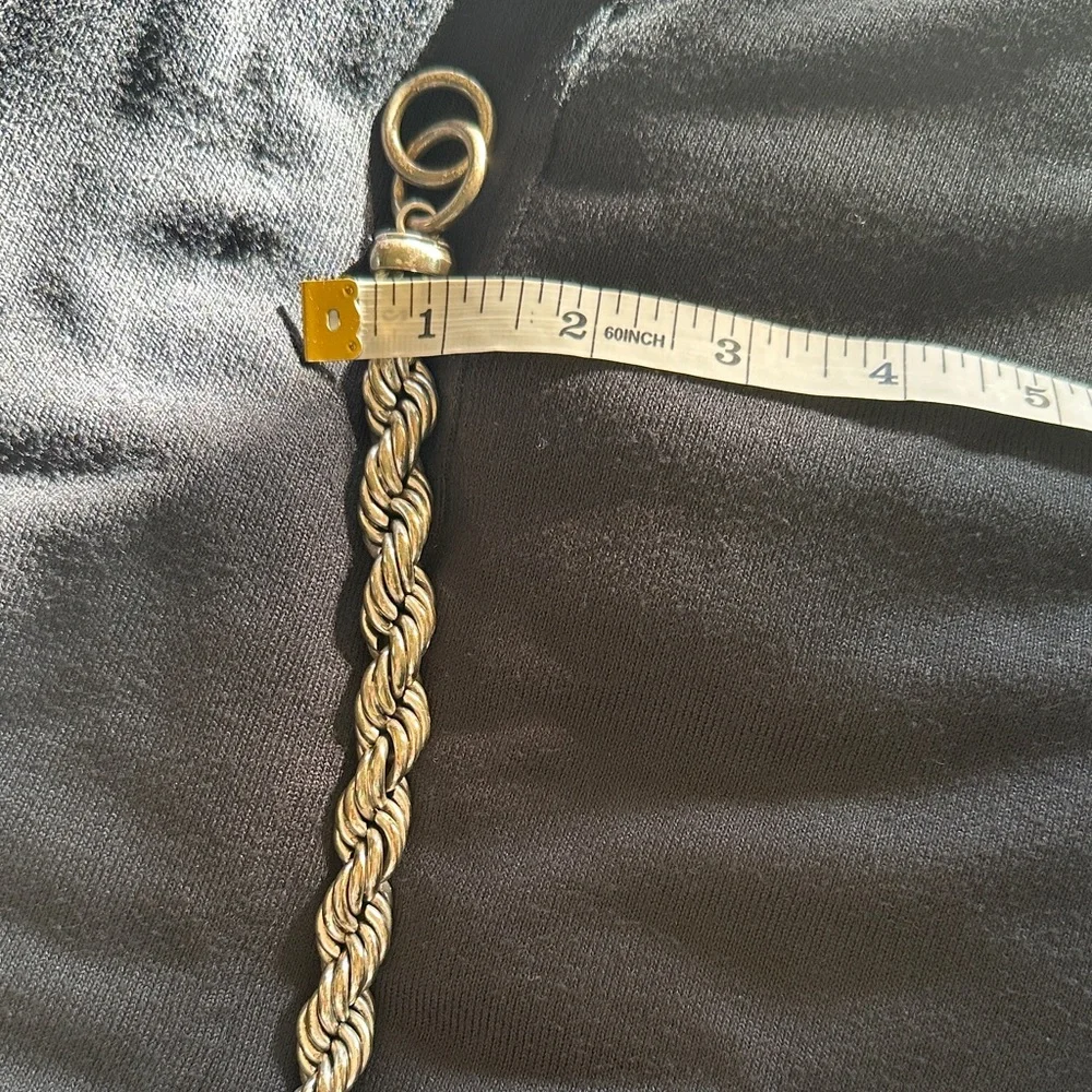 Elegant Silver Twist Bracelet - Picture 2 of 3